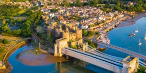 Aerial view of Conwy Castle, a 13th century castle with 8 towers and 2 barbicans, next to River Conwy.